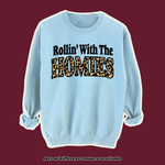 Load image into Gallery viewer, 90s-inspired light blue sweatshirt with &#39;Rollin’ With The Homies&#39; slogan in bold black and leopard print lettering. Retro oversized jumper, vintage hip-hop fashion, Y2K streetwear style
