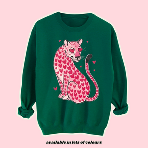 Heart leopard print sweatshirt – Pink leopard with heart spots and love-heart eyes on a fleece-lined unisex jumper. Trendy animal print sweater for women, men, and kids, available in multiple colour